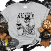 Staying Alive Coffee Skeleton Funny Halloween Women’s T-Shirt